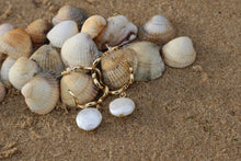 Load image into Gallery viewer, Giana natural pearl drop loop gold earrings sitting on seashells