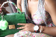 Load image into Gallery viewer, Lady holding green crocodile embossed leather bag with gold accessory