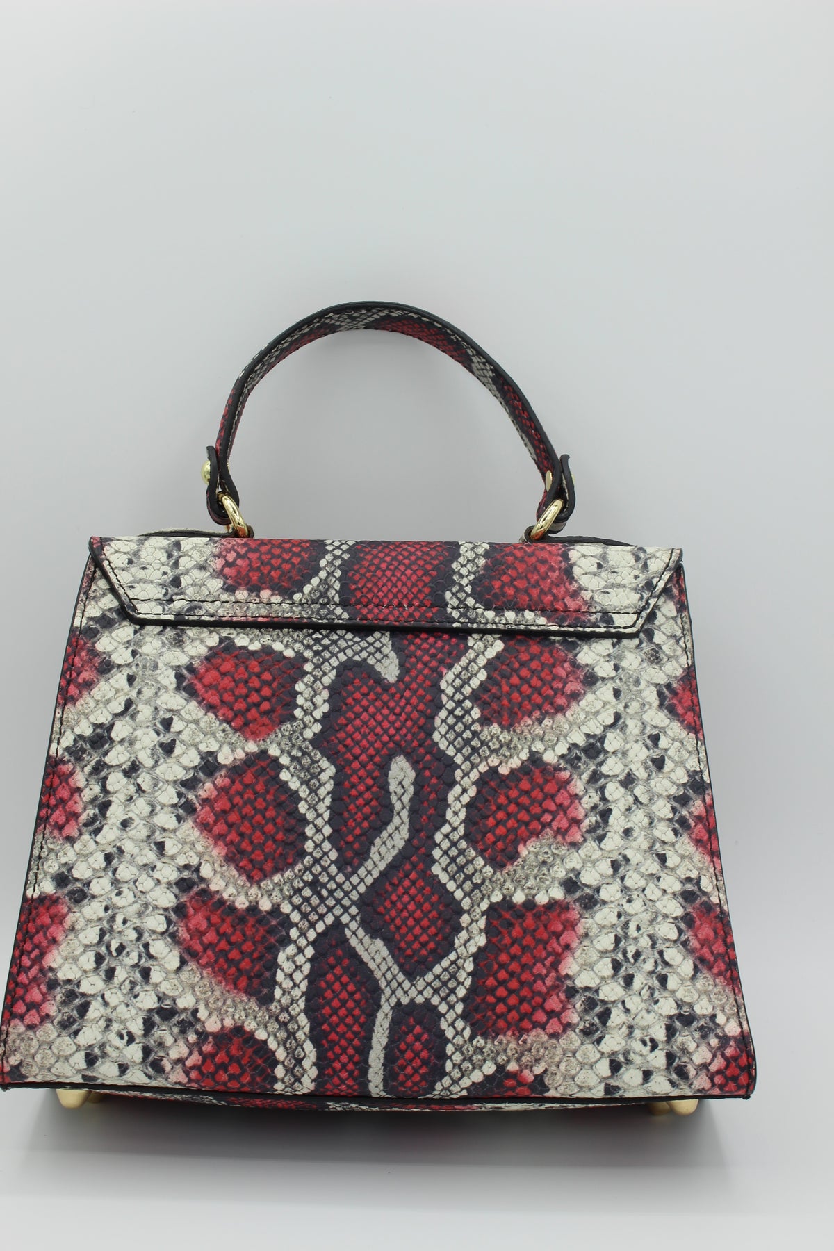 Red snake embossed leather bag back view