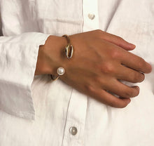 Load image into Gallery viewer, Gold plated Faux Pearl bangle on wrist
